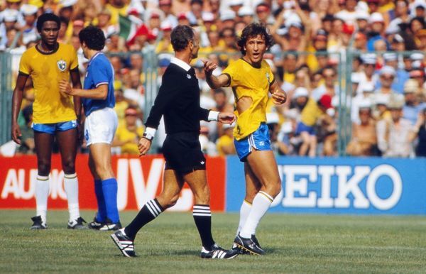 Brazil's Zico remonstrates with the referee after his shirt is ripped at the 1982 World Cup